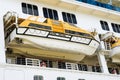 Side view of a large cruise ship with hanging lifeboat, emergency rescue boat Royalty Free Stock Photo