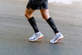 side view legs male runner in compression sleeves