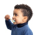 Side view of little afro american boy brushing teeth