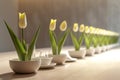 A side view of a long Easter dining table with a row of small vases, each holding a single yellow tulip.