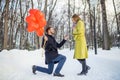 Side view on lovely couple at street, marriage proposal Royalty Free Stock Photo