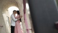 Side view of loving man and woman kissing lips. Action. Young beautiful couple in love kissing outdoors on a summer in Royalty Free Stock Photo