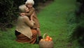 Happy woman with daughter in sunny garden