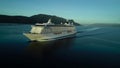 Side view of luxury cruise boat floating on misty mountains silhouettes canal beaurtiful nature background