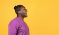 Side view of mad african american guy shouting looking aside Royalty Free Stock Photo
