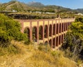 A side view of the majestic, four storey, Eagle Aqueduct that spans the ravine of Cazadores near Nerja, Spain Royalty Free Stock Photo