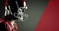 Side view of male american football athlete wearing helmet looking at red copy space Royalty Free Stock Photo