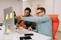 Side view of male teacher, manager or mentor helping young female student, new employee, teaching intern, explaining Royalty Free Stock Photo