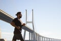 Side view of man with disability running outdoors