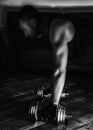 Side view of a man doing plank with metal dumbbells Royalty Free Stock Photo