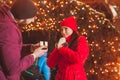 Side view of man making proposal of marriage on Christmas eve outdoors