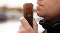 Side View Of Man Taking Breathalyzer Test. Driver Checking For Alcohol Intoxication Level. Royalty Free Stock Photo