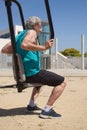 side view of a man training on the street with sports machine Royalty Free Stock Photo