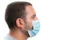 Side-view of man wearing surgical or medical mask with copy area