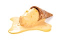 Mango flavor ice cream cone in a melting process on white with clipping path