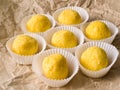 Side view of many chocolate truffles coated with freeze dried orange. Royalty Free Stock Photo