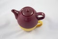 Bicolor ceramic teapot on white background.