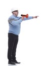 Side view. a Mature man with a megaphone explains something. Royalty Free Stock Photo