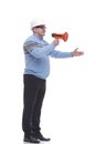 side view. a Mature man with a megaphone explains something. Royalty Free Stock Photo