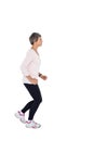 Side view of mature woman jogging Royalty Free Stock Photo