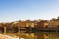 Side view of medieval stone bridge Ponte Vecchio over the Arno River in Florence, Italy Royalty Free Stock Photo