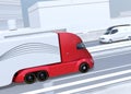 Side view of metallic red self-driving electric semi trucks and minivan on highway Royalty Free Stock Photo