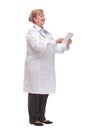 Side view of a middle age smiling doctor using a tablet computer Royalty Free Stock Photo