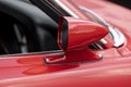 Side view mirror on red classic car Royalty Free Stock Photo