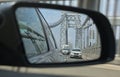 side view mirror view of road with george washington bridge (car, truck, road, traffic, highway) Royalty Free Stock Photo