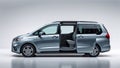 Side view of a modern minivan with sliding doors and flat side panels on white background Royalty Free Stock Photo