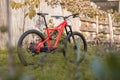 Side view of a modern mountain bike or bicycle for off road. Enuduro mtb bicycle parked on a lawn. Red MTB standing upright on Royalty Free Stock Photo