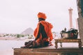 side view of monk in traditional clothing meditating