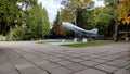Side view of a monument in the form of a fighter plane taking off in an autumn park Royalty Free Stock Photo