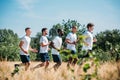 side view of multicultural group of soldiers running