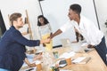 side view of multiethnic business partners shaking hands at meeting Royalty Free Stock Photo