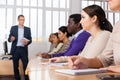 Young woman with group of adult people during professional training Royalty Free Stock Photo