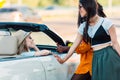 side view of multiethnic smiling women having conversation