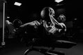 Monochrome portrait of man training abs with ball. Royalty Free Stock Photo