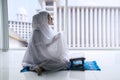 Muslim woman prays to the Allah at home Royalty Free Stock Photo