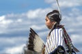 Side view of Native American against blue sky.