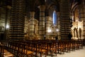 Inside the Cathedral of Siena. Side view of the nave with chairs for mass.
