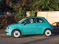 Side view of new Fiat 500 Cinquecento mini turquoise car parked on the street Royalty Free Stock Photo