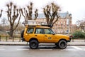 Side view of new vintage yellow Land Rover Defende