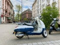 Side view of new white blue Scooter Django Standard 125 by Peugeot Motocycles