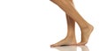 Side view of a nude barefoot female leg and fee