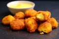 side view of nuggets with a dollop of mustard Royalty Free Stock Photo