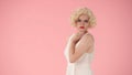 Side view of an offended young woman with pouting lips. Profile portrait of woman looking like Marilyn Monroe, wearing Royalty Free Stock Photo