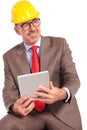 Side view of an old construction engineer with tablet pad Royalty Free Stock Photo