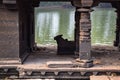 .Side view of an old hindu temple,there is a ancient bull statue in temple