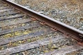 Side view of a old train track plate, spikes, rail and sleepers Royalty Free Stock Photo